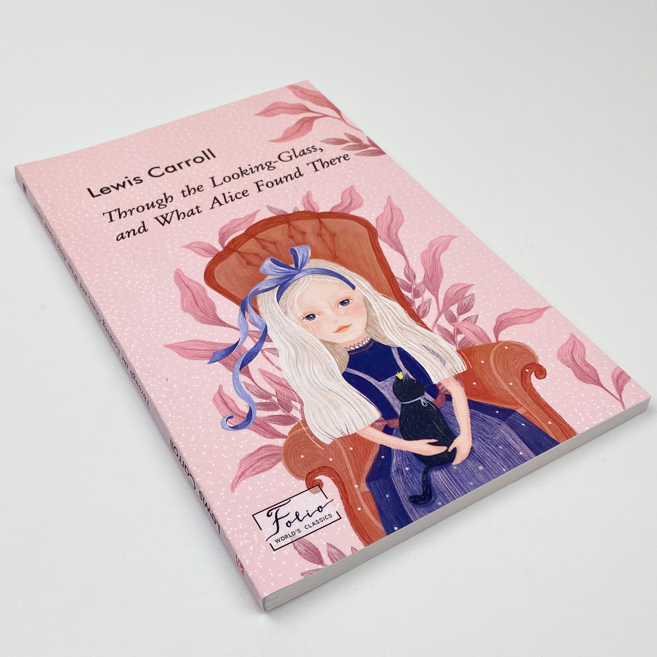 Through the Looking-Glass, and What Alice Found There (Аліса в Задзеркаллі). Автор — Льюїс Керол. 